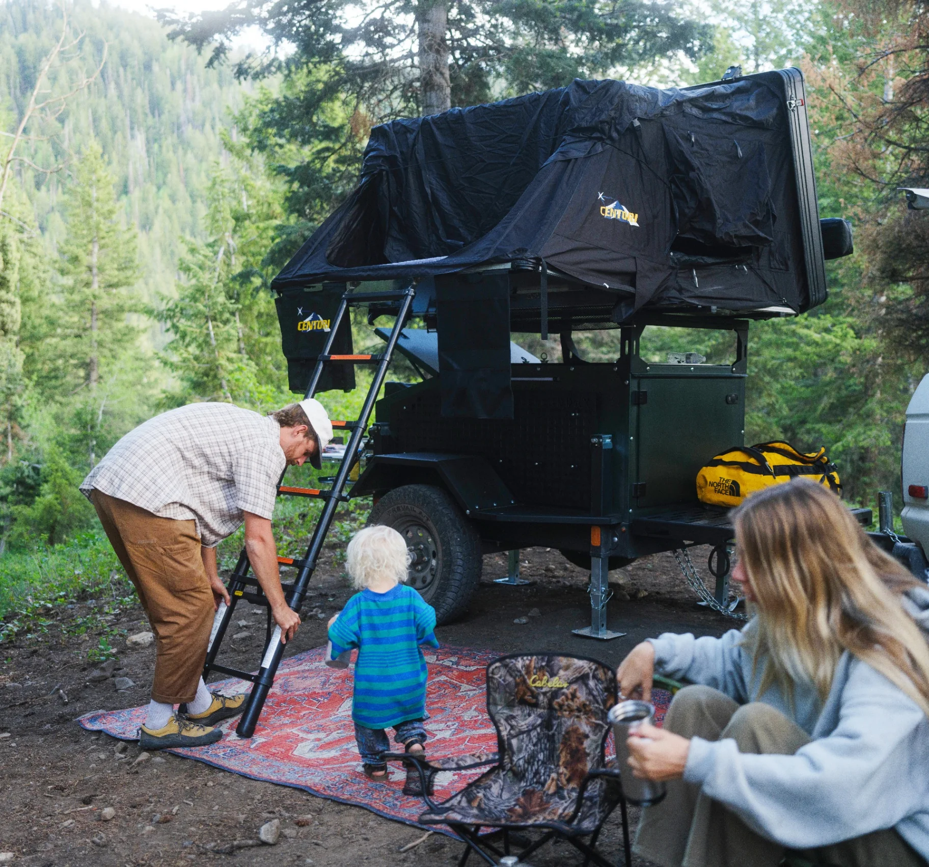 Family camp set up around an ADDAX Basecamp trailer in the backcountry
